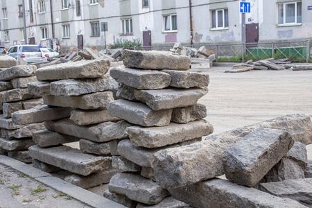 repair of roads.the curb from the dismantled road lies on the asphaltの写真素材
