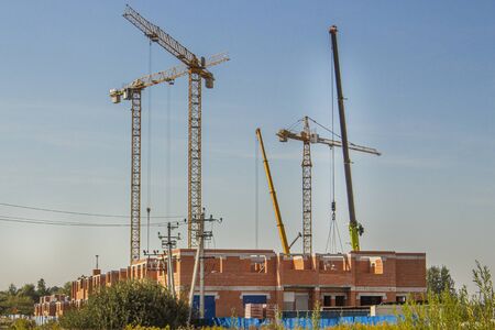 construction tower cranes are on the construction siteの写真素材