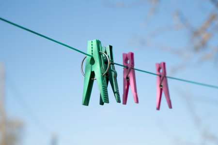 clothespins for drying clothes hang on a rope 1の写真素材