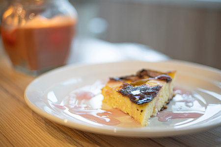 cottage cheese casserole stands on a wooden table close up 1の写真素材