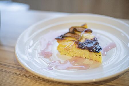 cottage cheese casserole stands on a wooden table close up 1の写真素材