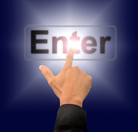 finger push enter button on touch screen interface の写真素材