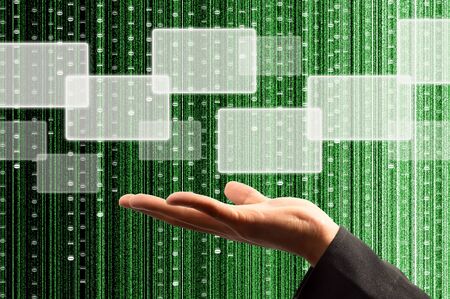 hand hold a touch screen interface with digital matrix backgroundの写真素材