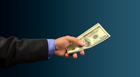 business man holding money in hand 