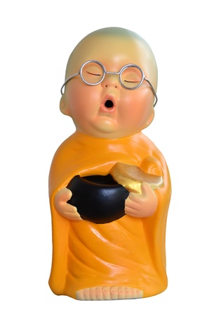 Earthenware of child monk isolated on white background の写真素材