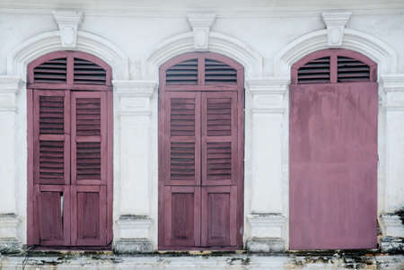 old window in phuket, thailandの写真素材