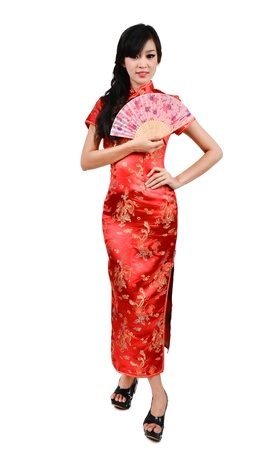 pretty women with Chinese traditional dress Cheongsam and hole Chinese Fan on white backgroundの写真素材