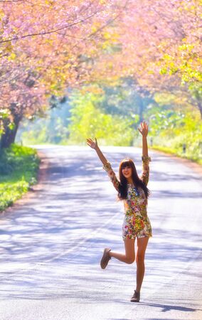 Happy woman on the road の写真素材