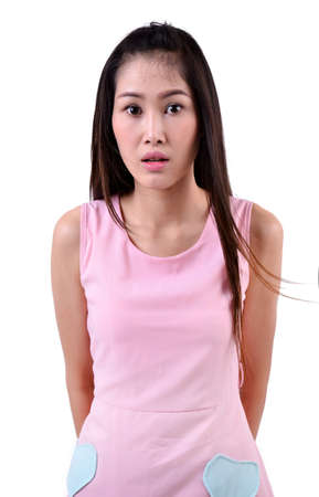 beautiful woman looking surprised against a white backgroundの写真素材