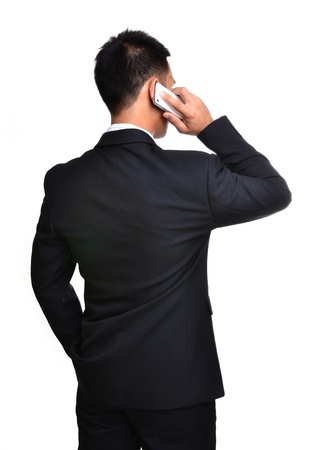 business man use mobile phone isolated on white backgroundの写真素材