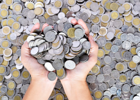 a lot of coins in the hands