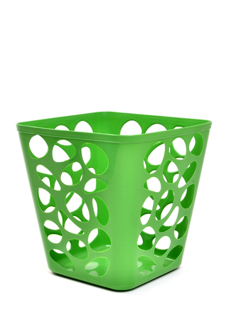 green plastic basket isolated on white backgroundの写真素材