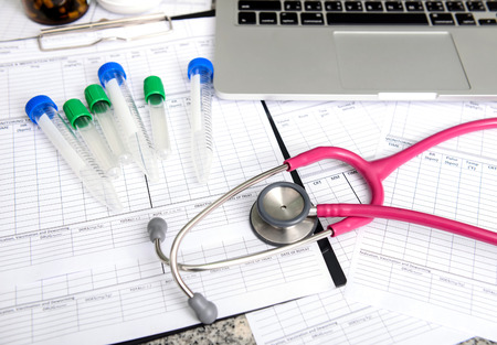 stethoscope and labtop and other medical object on the tableの写真素材