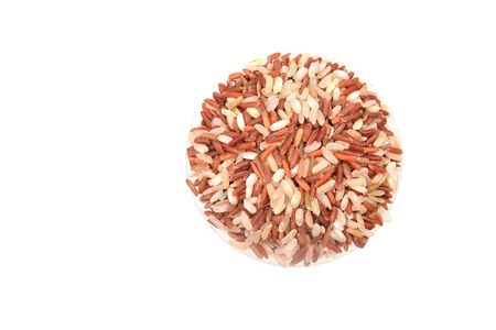 milled rice imperfectly cleaned in measuring cupの写真素材