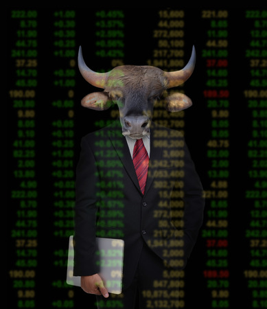 business man with bull head in tock investment conceptの写真素材