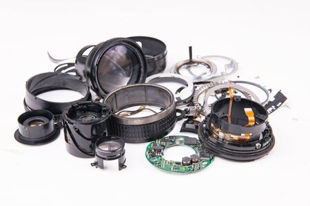 camera lens has been dropped and shattered on white backgroundの写真素材