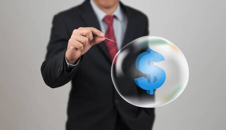 hand hole needle with dollar symbol in the bubbleの写真素材