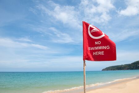 No swimming danger sign at the beachの写真素材