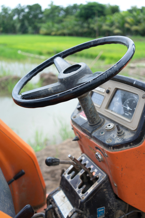 Tractor in a rice fieldの写真素材