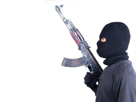 terrorist with ak47 machine gun isolated on white background