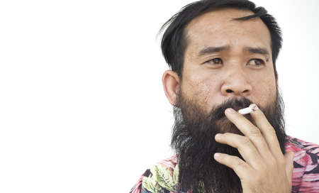 Portrait of adult man who is smoking cigaretteの写真素材