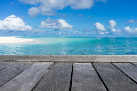 Wooden floor with seascape and blue sky backgroundの写真素材