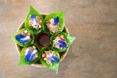 Traditional thai snack Miang Kham or Savoury Leaf Wrapsの写真素材