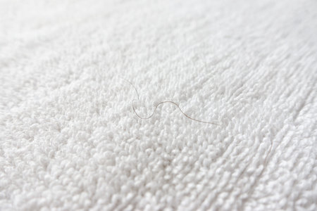 pubic hair fall on white towel