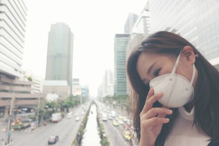 woman wearing protective mask in the city street, Bangkok thailandの写真素材