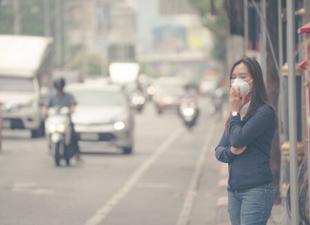 woman wearing protective mask in the city street, Bangkok thailandの写真素材