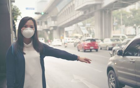woman wearing protective mask in the city street, Bangkok thailandの写真素材