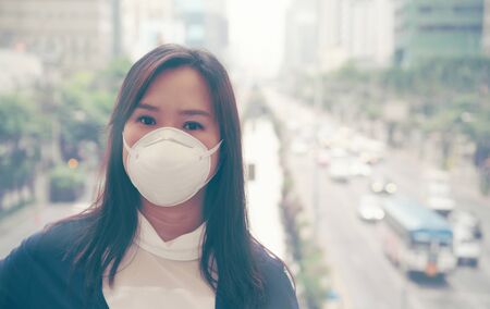 woman wearing protective mask in the city street, Bangkok thailandの写真素材