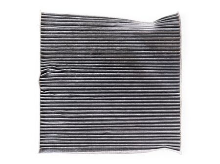 dirty car air conditioning filter isolated on white backgroundの写真素材