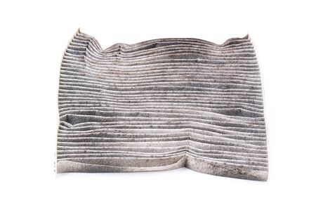 dirty car air conditioning filter isolated on white backgroundの写真素材