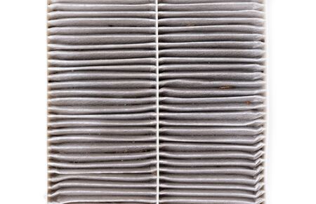 dirty car air conditioning filter isolated on white backgroundの写真素材