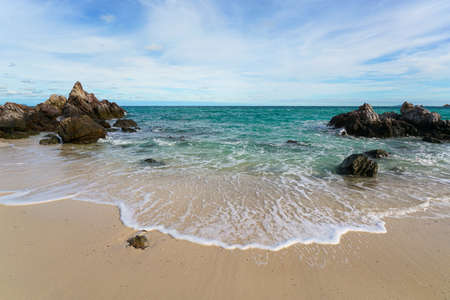 Sand beach among rocks, koh lan island thailandの写真素材