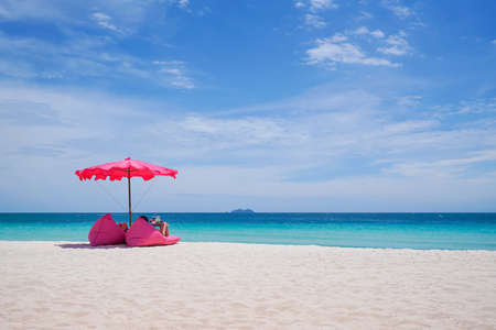Pink parasol and  seat on the tropical beach, Vacation background.,Idyllic beachの写真素材