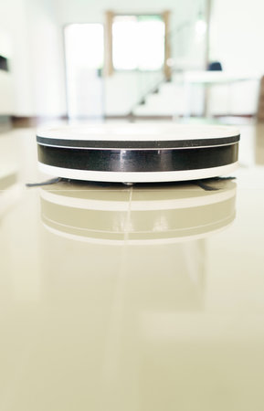 home vacuum cleaning robot cleaning the roomの写真素材