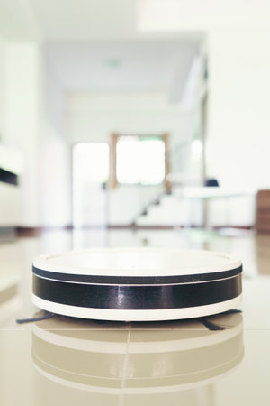home vacuum cleaning robot cleaning the roomの写真素材