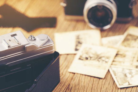 vintage camera on the background of old photosの写真素材