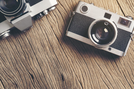vintage old film camera on wood board with copy spaceの写真素材
