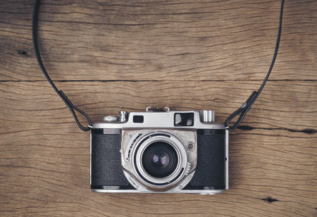 vintage old film camera on wood board with copy spaceの写真素材