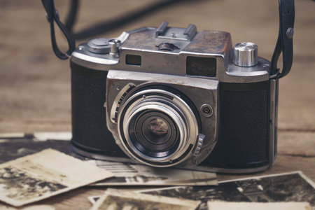 vintage camera on the background of old photosの写真素材