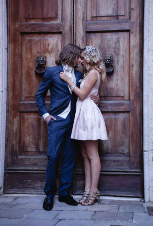 fashionable couple standing and huggingのeditorial素材