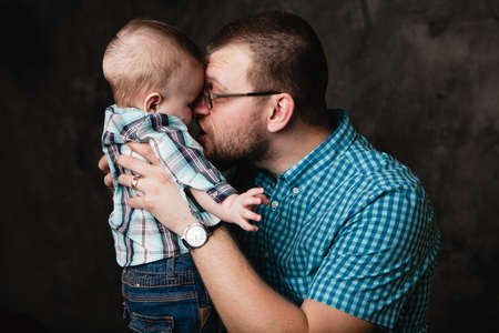 young father holding little boyの写真素材