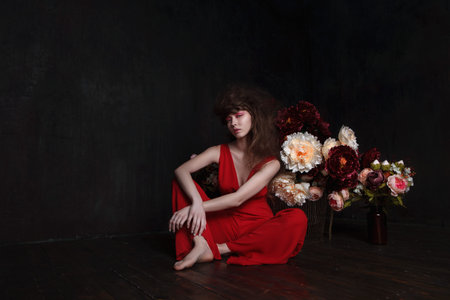 fashion studio portrait of a girl with flowersの写真素材