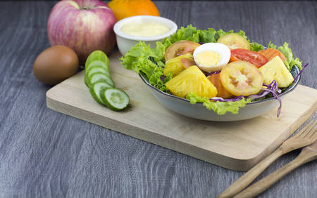 Fresh organic salad with dipping sauce on wooden for good healthy and dietの写真素材