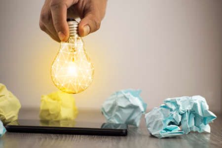 coin with light bulb business concept coins and light bulb. concept saving moneyの写真素材