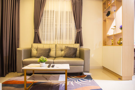Interior of a hotel room with a sofa and a coffee tableの写真素材