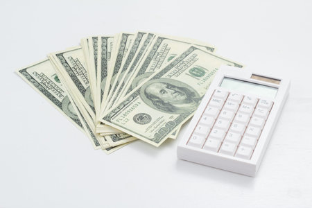 US bank note and calculator on white background